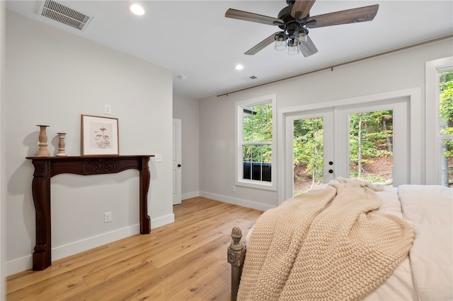 bedroom featuring light wood-style floors, recessed lighting, visible vents, and access to exterior