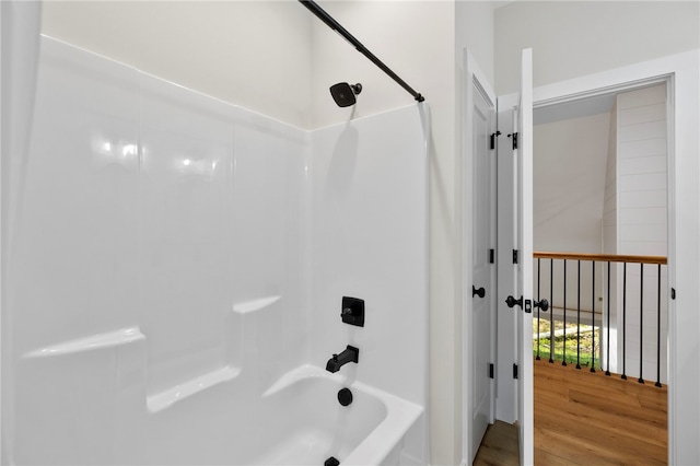 bathroom featuring shower / tub combination and wood finished floors