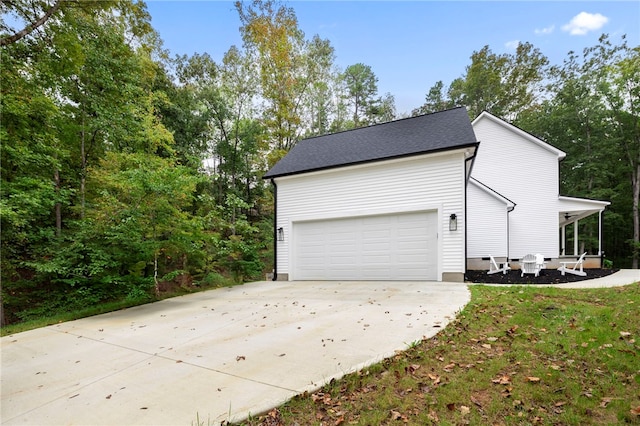 exterior space featuring concrete driveway