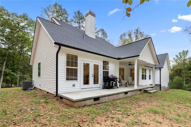 rear view of property featuring french doors, a chimney, a ceiling fan, crawl space, and central AC