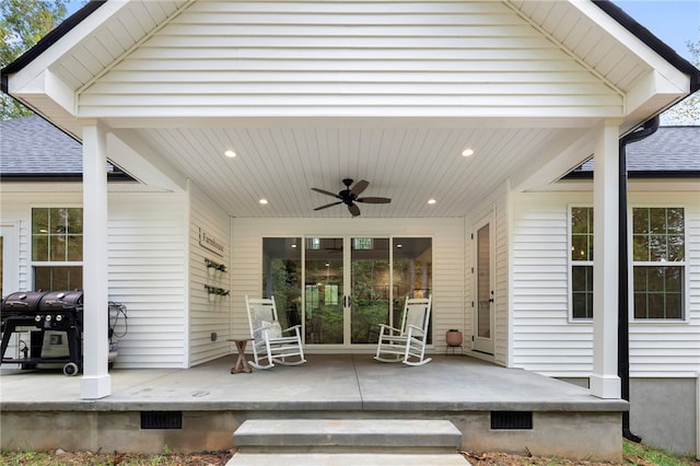 view of patio with covered porch, area for grilling, and a ceiling fan