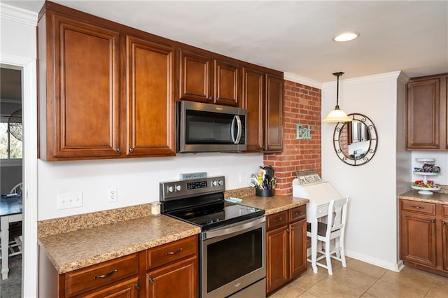 kitchen featuring stainless steel appliances, crown molding, light countertops, light tile patterned floors, and hanging light fixtures