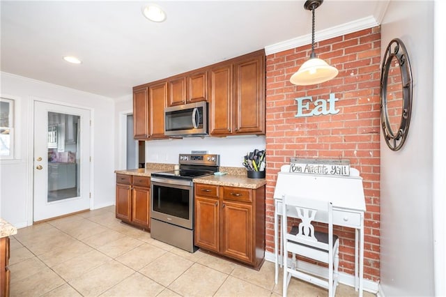 kitchen with crown molding, pendant lighting, light tile patterned floors, brown cabinetry, and stainless steel appliances