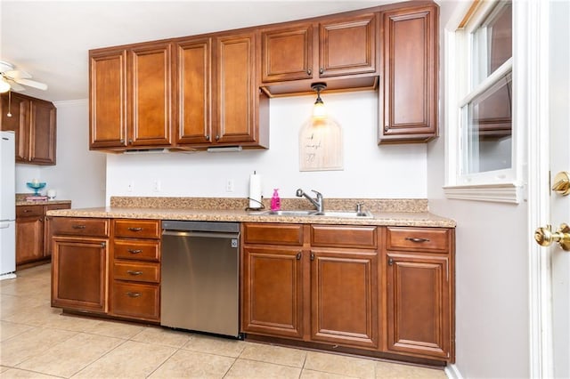 kitchen with a ceiling fan, freestanding refrigerator, a sink, light countertops, and dishwasher