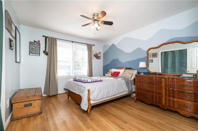 bedroom featuring wood finished floors and a ceiling fan