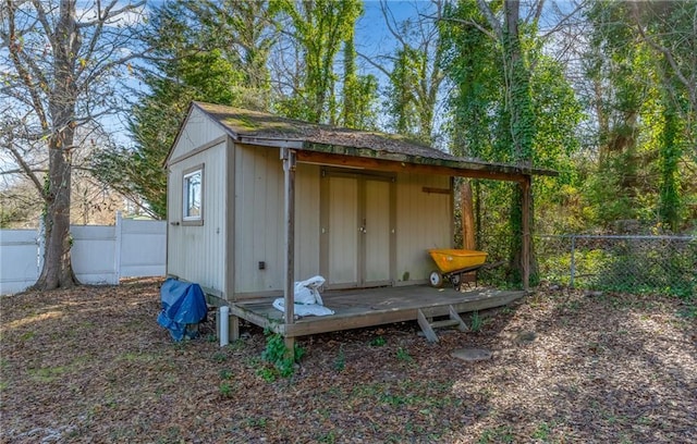 view of outbuilding featuring an outdoor structure and a fenced backyard