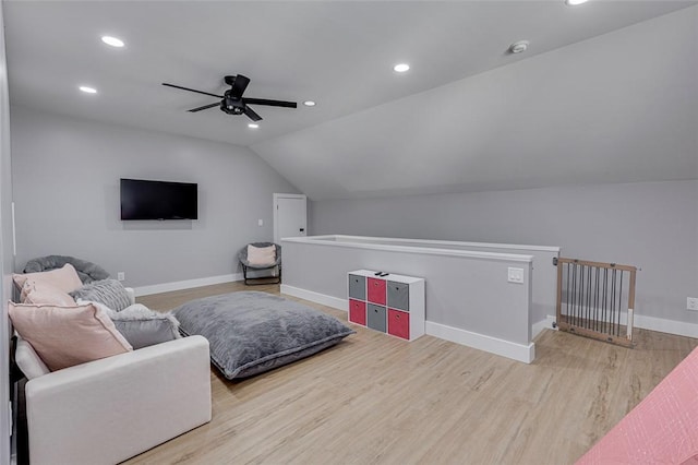 living room with recessed lighting, ceiling fan, vaulted ceiling, wood finished floors, and baseboards