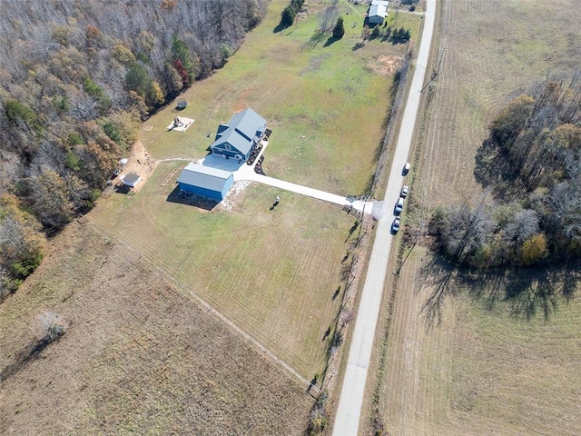 birds eye view of property with a rural view