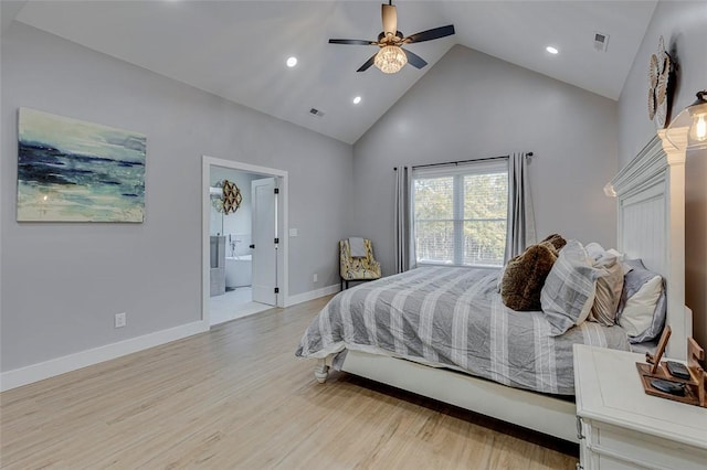 bedroom featuring high vaulted ceiling, visible vents, baseboards, light wood finished floors, and ensuite bath