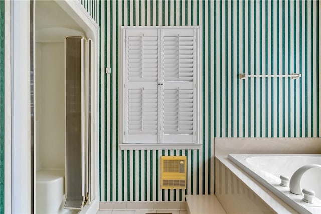 full bath featuring wallpapered walls, a washtub, and walk in shower