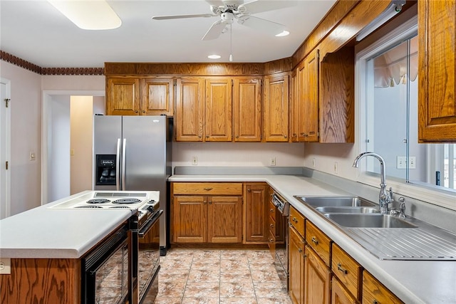 kitchen with brown cabinetry, light countertops, black appliances, and a ceiling fan