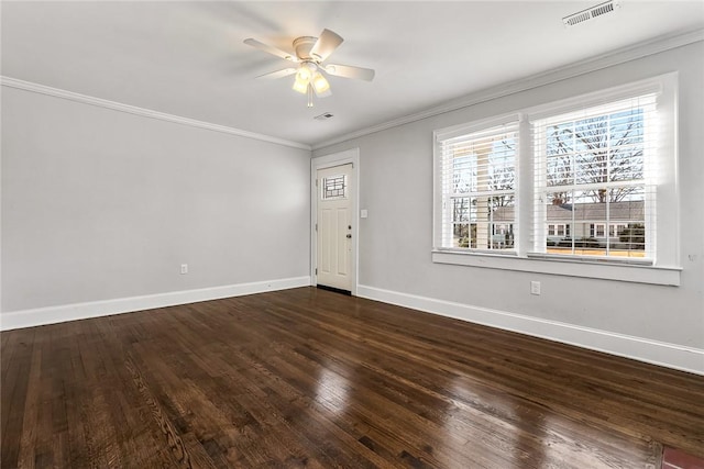 entrance foyer with ornamental molding, visible vents, and baseboards