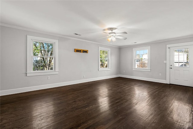 interior space featuring dark wood-style floors, crown molding, and a wealth of natural light