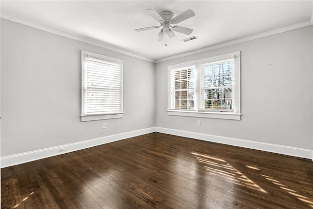 unfurnished room with ceiling fan, dark wood-type flooring, visible vents, baseboards, and ornamental molding