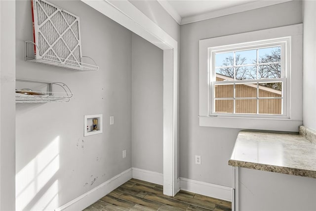 clothes washing area with hookup for a washing machine, laundry area, dark wood-type flooring, baseboards, and ornamental molding