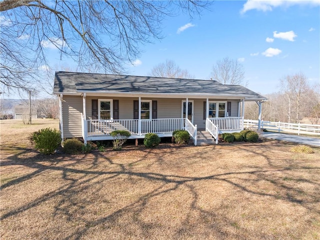 123 Bass Dr, Fair Play, SC 29643 - view of front facade with fence, a porch, and a front lawn