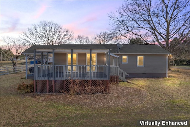 123 Bass Dr, Fair Play, SC 29643 - back of house at dusk with fence, a yard, a porch, and crawl space