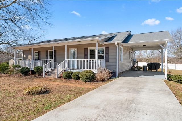 123 Bass Dr, Fair Play, SC 29643 - view of front of house featuring covered porch, a carport, driveway, and a front lawn