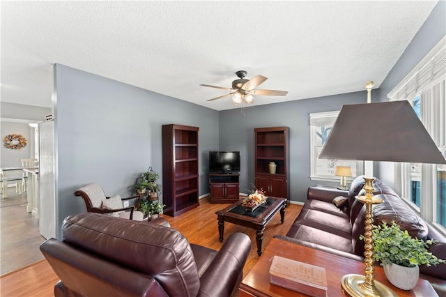 123 Bass Dr, Fair Play, SC 29643 - living room with a textured ceiling, ceiling fan, and wood finished floors