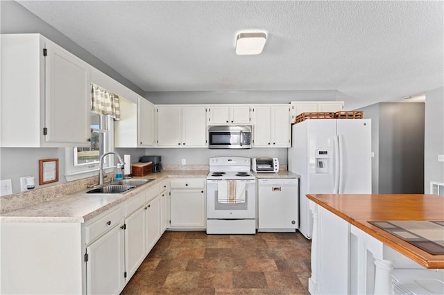 123 Bass Dr, Fair Play, SC 29643 - kitchen with white appliances, stone finish floor, light countertops, white cabinets, and a sink