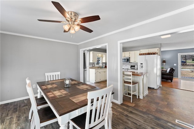 123 Bass Dr, Fair Play, SC 29643 - dining space with plenty of natural light, ornamental molding, dark wood-style flooring, and ceiling fan