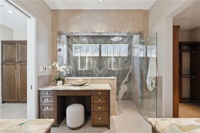 bathroom featuring a shower stall, vanity, and tile patterned floors