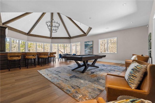 game room featuring billiards, baseboards, wood finished floors, an inviting chandelier, and high vaulted ceiling