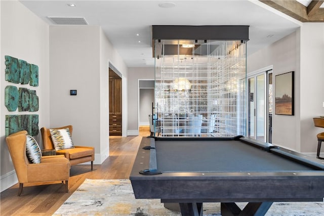 game room with visible vents, light wood-style flooring, and baseboards