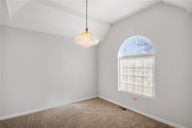 spare room with lofted ceiling, carpet, visible vents, and baseboards