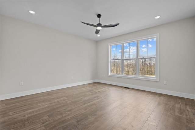 empty room featuring visible vents, baseboards, ceiling fan, light wood-style floors, and recessed lighting