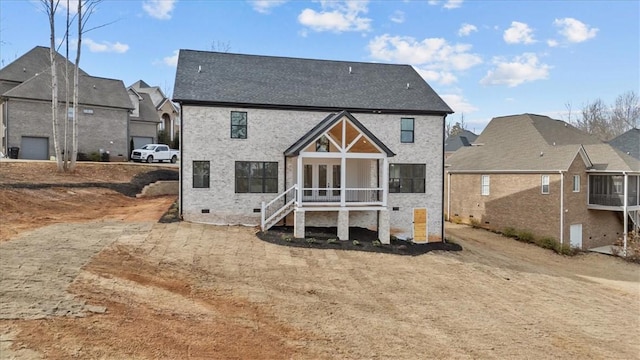 back of property with crawl space and a residential view