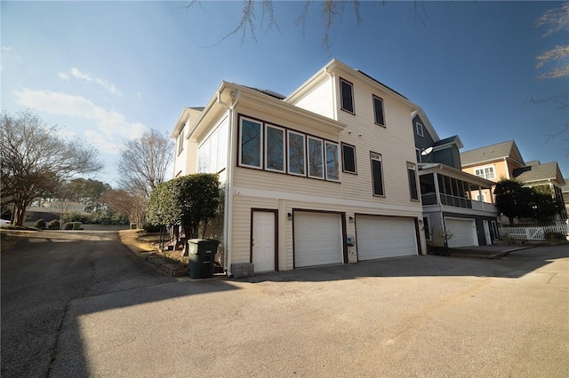 exterior space with driveway and an attached garage