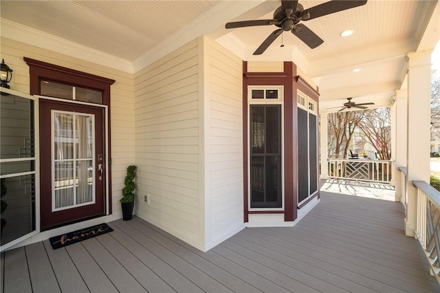 deck with covered porch and ceiling fan