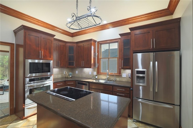 kitchen featuring tasteful backsplash, glass insert cabinets, stainless steel appliances, crown molding, and a sink