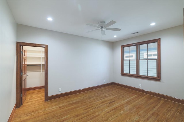 interior space featuring visible vents, baseboards, ceiling fan, light wood-style floors, and recessed lighting