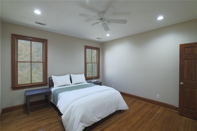 bedroom with baseboards, visible vents, wood finished floors, and recessed lighting