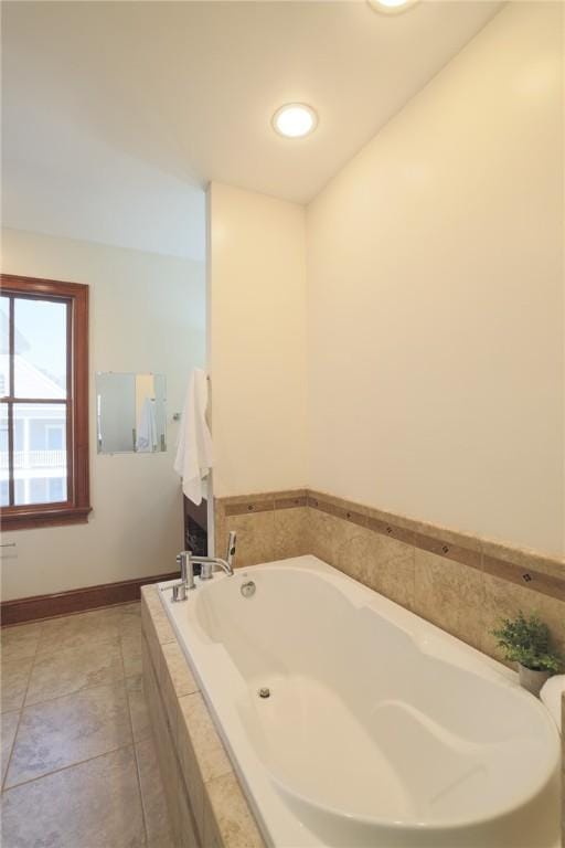 full bathroom with tile patterned flooring, a garden tub, baseboards, and recessed lighting