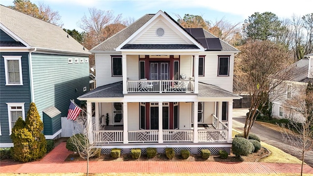 417 Village Walk Ln, Clemson, SC 29631 - view of front of house with a porch, a balcony, roof mounted solar panels, and a shingled roof