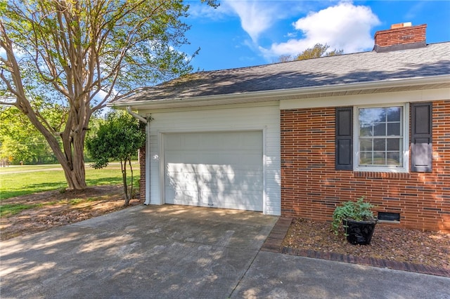 garage featuring concrete driveway