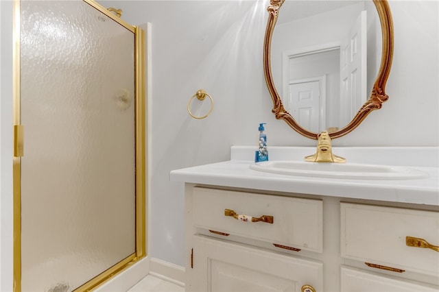 full bath with a shower stall and vanity