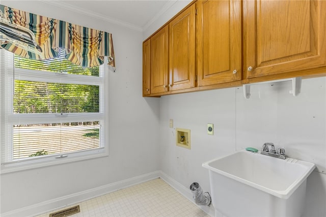 laundry room featuring crown molding, hookup for a washing machine, visible vents, cabinet space, and a sink