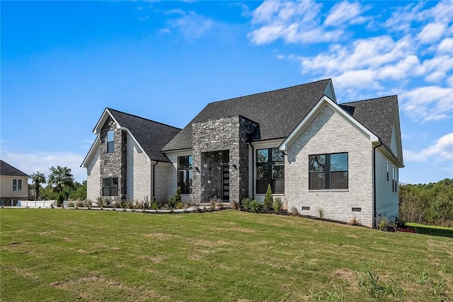 view of front facade featuring stone siding, crawl space, brick siding, and a front lawn