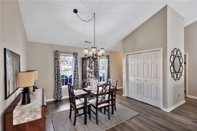 dining area featuring visible vents, baseboards, a chandelier, dark wood-type flooring, and high vaulted ceiling