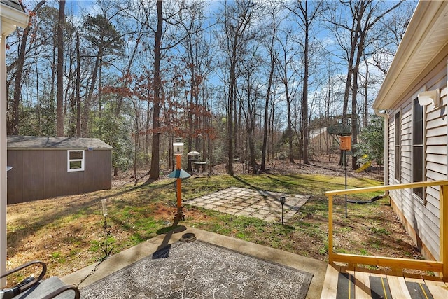 view of yard with a patio area and an outdoor structure