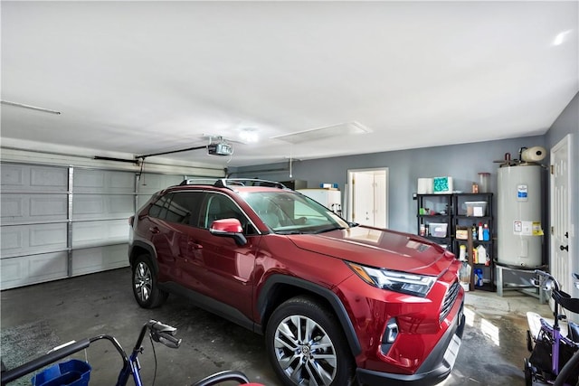 garage featuring water heater and a garage door opener