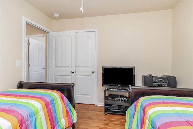 bedroom featuring wood finished floors