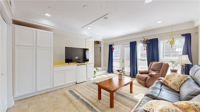 living room with light tile patterned floors and recessed lighting