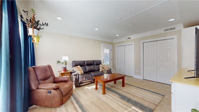 living room featuring recessed lighting, visible vents, crown molding, and light tile patterned flooring