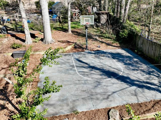 view of sport court with community basketball court and fence