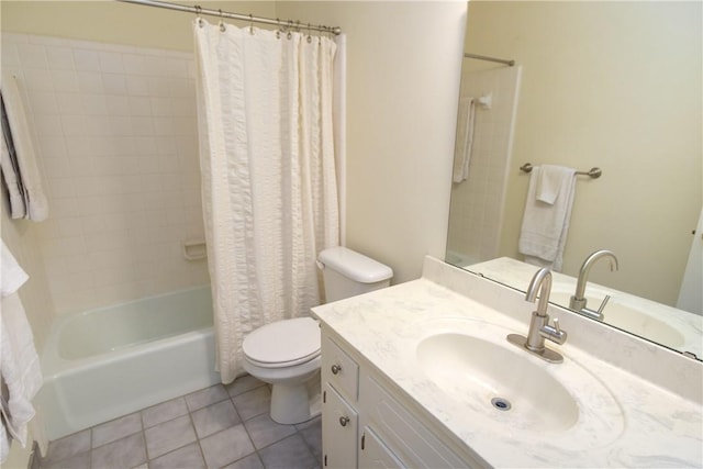 bathroom with toilet, tile patterned flooring, shower / bath combo, and vanity